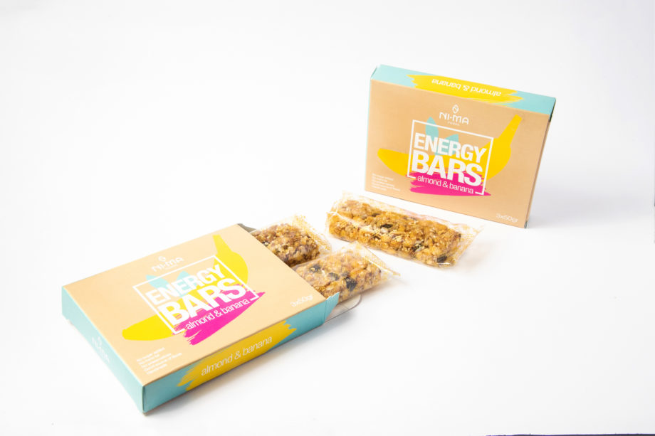 two boxes of almond banana bars, one open where you can see bars