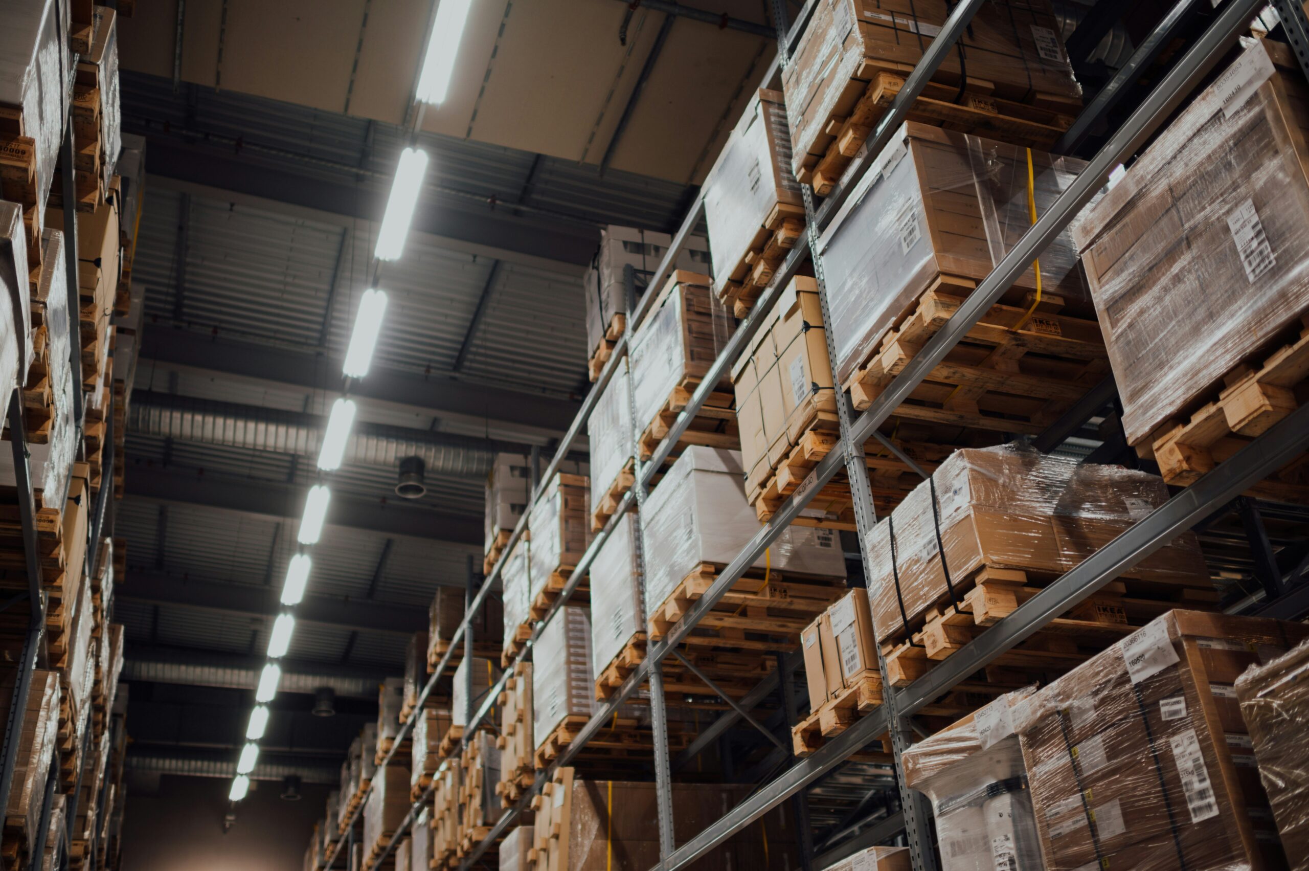 Organised warehouse storage with palletised goods representing structured international food supply chain management